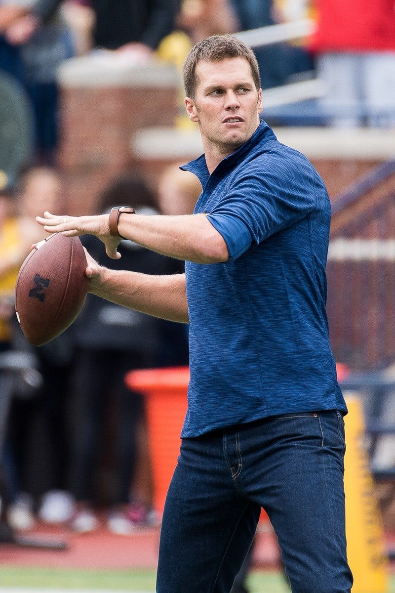 Brady throwing a football