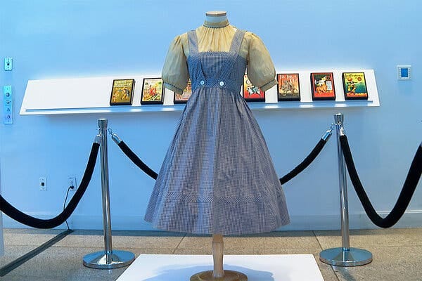 A blue-and-white checked gingham dress, worn by Judy Garland in “The Wizard of Oz,” was exhibited last month at Bonhams in New York.