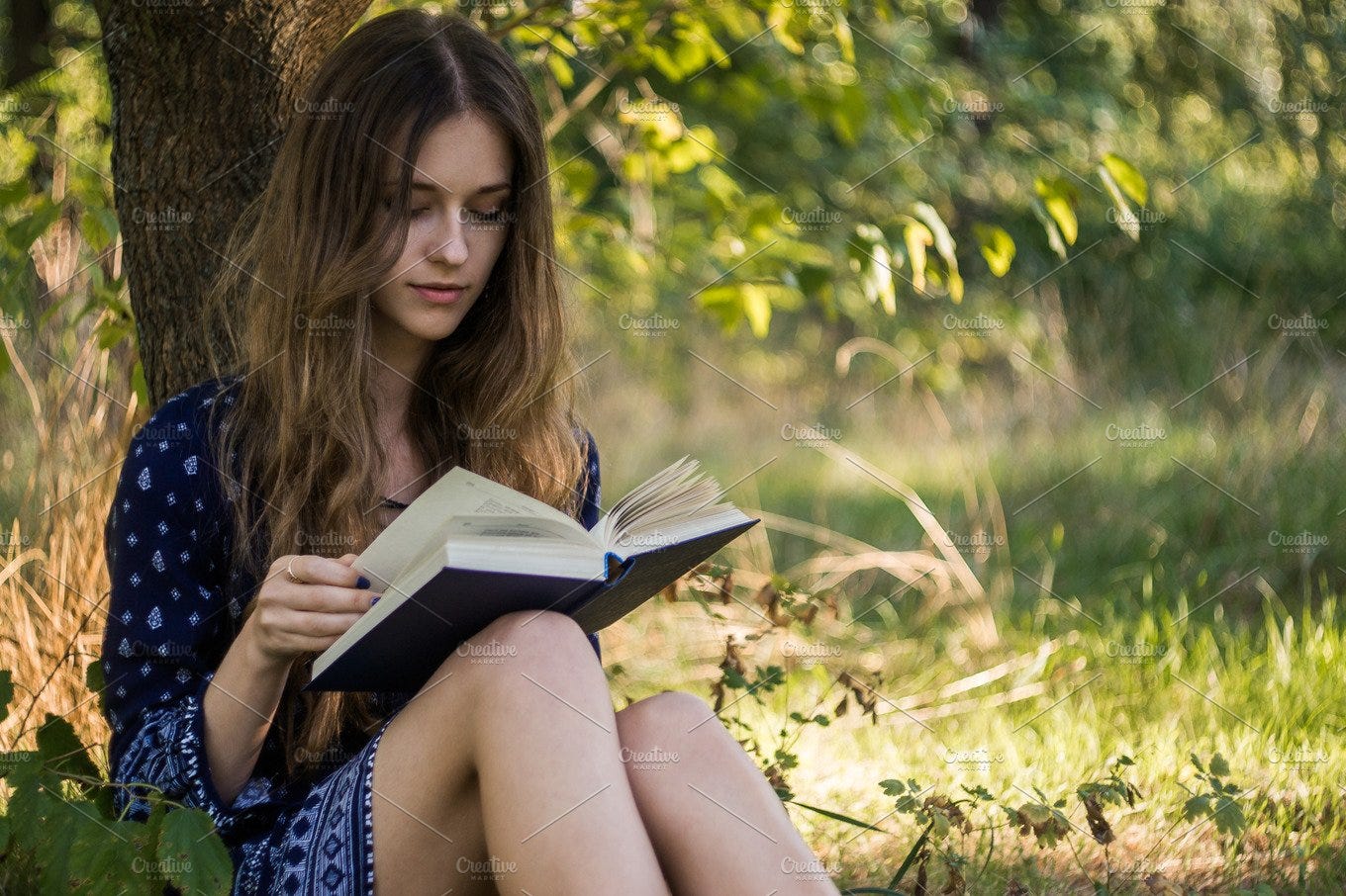Girl reading a book in summer forest containing 20-29, girl, and beautiful  | High-Quality People Images ~ Creative Market