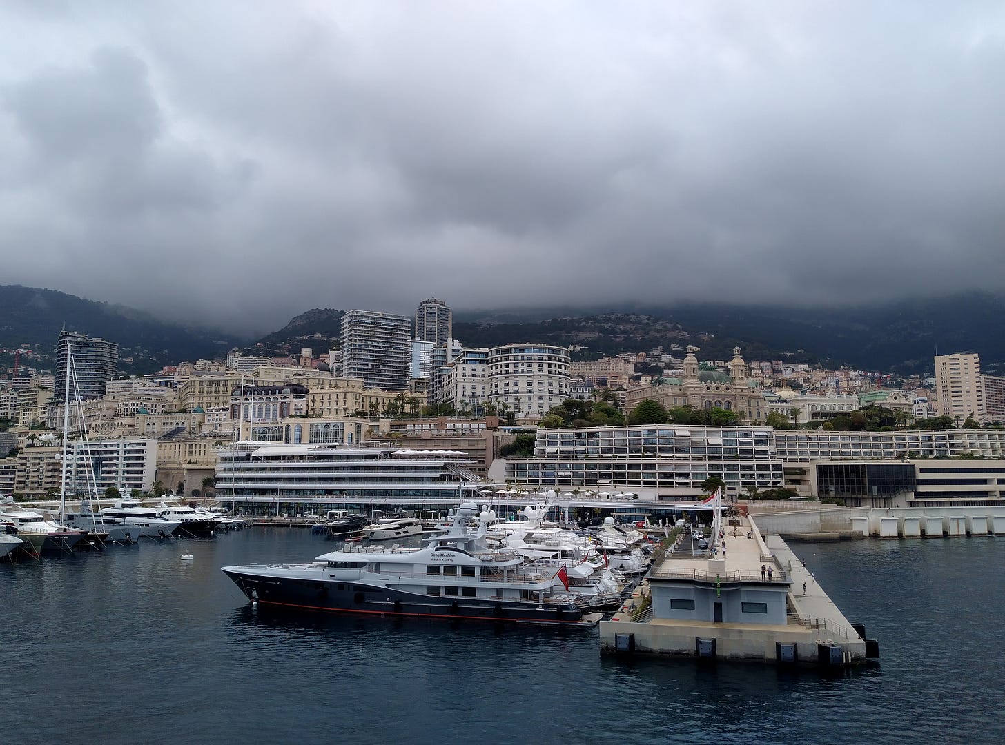 photo of Monaco from the harbour. The hillside is crowded with buildings.
