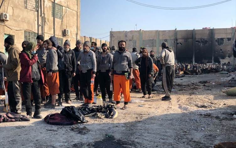 Recaptured ISIS prisoners are lined up by the SDF following a jail break by the group in Hasaka. Date: January 2022. Photo: handout 
