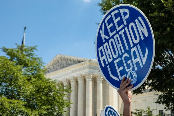 Supporters of reproductive rights marching in front of the Supreme Court on Thursday.