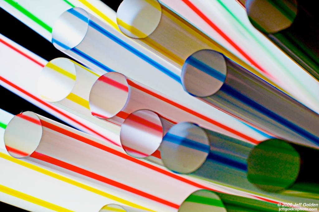 A collection of generic white straws with colorful stripes, just like my grandma's. "Straws" by jeff_golden is licensed under CC BY-SA 2.0 