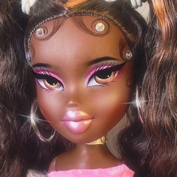 a close up picture of the Bratz doll Kiana with pink eyeshadow and swooped, bedazzled edges