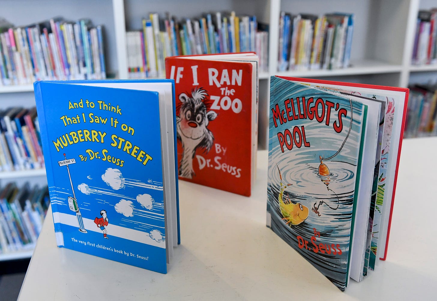 Photo of Dr. Seuss books "And to Think That I Saw It on Mulberry Street," "If I Ran the Zoo," and "McElligot's Pool"
