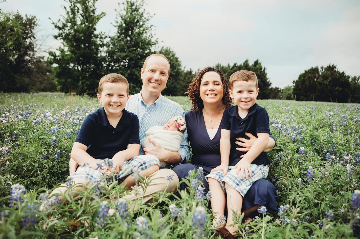 May be an image of 3 people, people standing, Texas bluebonnet and nature