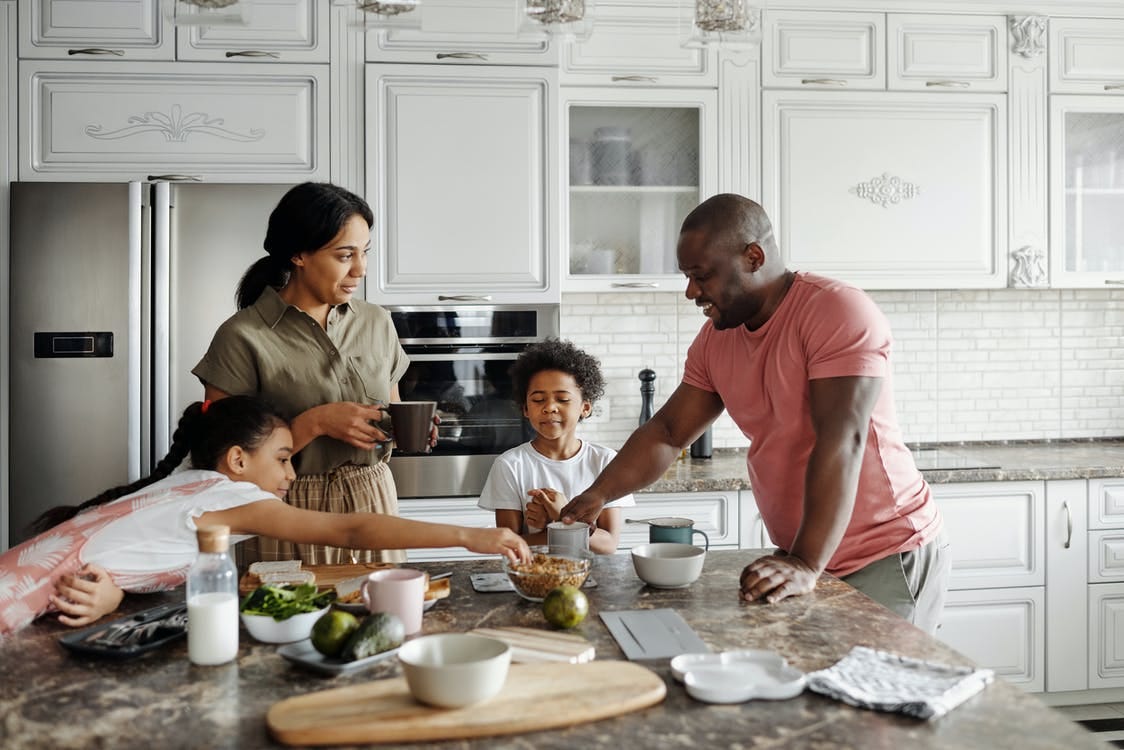 Free Family Making Breakfast in the Kitchen Stock Photo