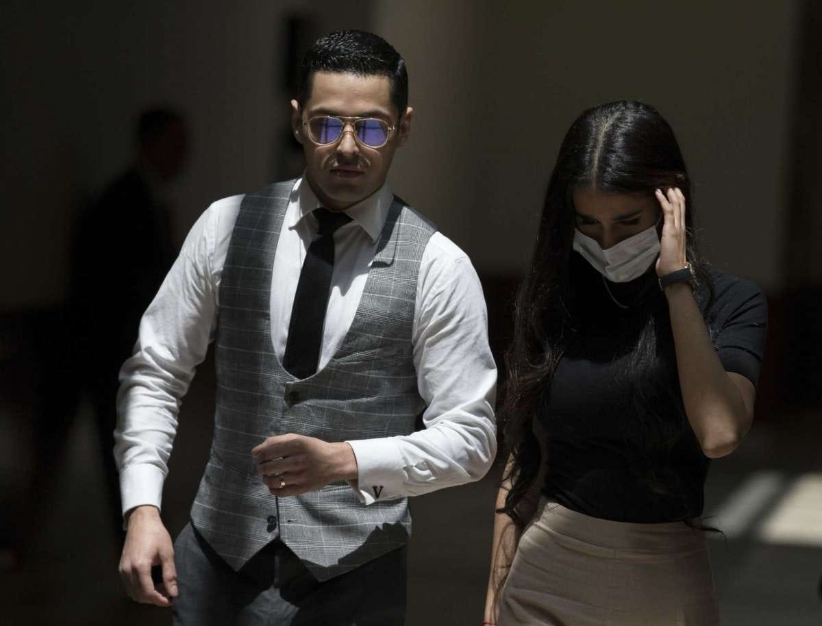 Victor Hugo Cuevas, a 26-year-old linked to a missing tiger named India, and his wife exit Fort Bend County Justice Center during a lunch break in the bond revocation hearing of a separate murder charge he's facing on Friday, May 14, 2021, in Richmond.