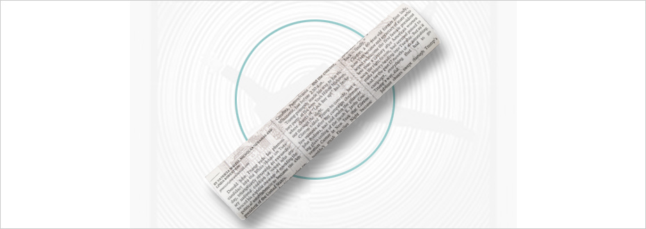 A rolled up newspaper seems to fall into a circular vortex.