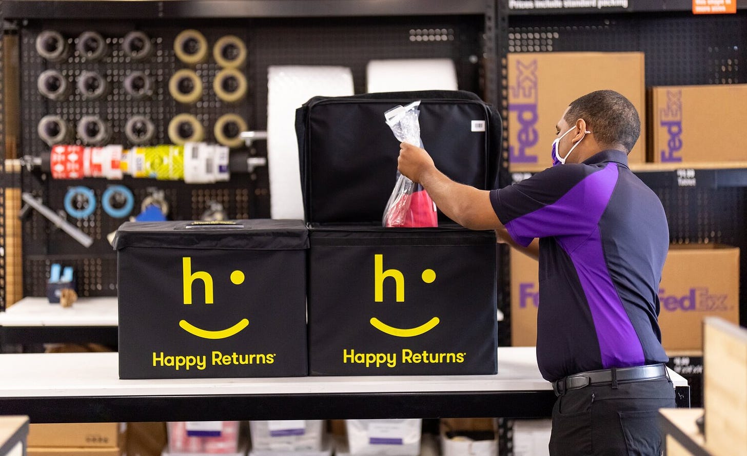 Image of a guy picking up something from a Happy Returns bag