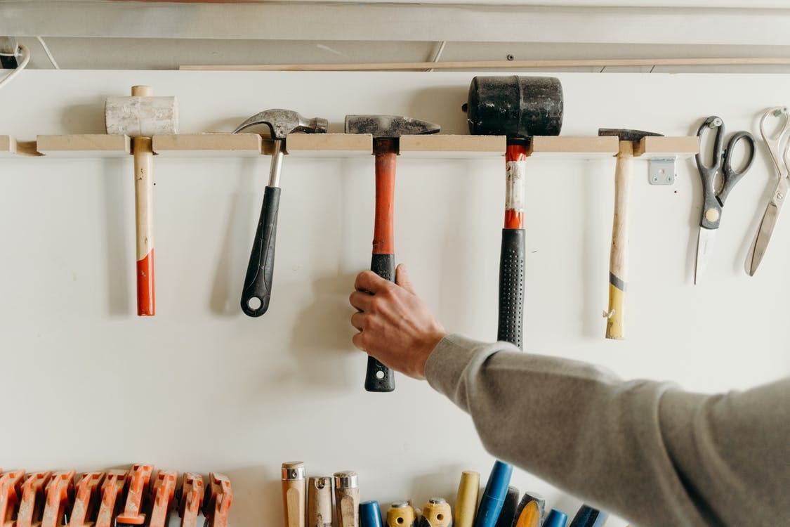 Person Holding Black and Gray Hammer