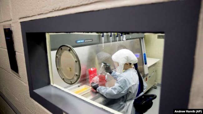 Laboratory scientist Andrea Luquette cultures coronavirus to prepare for testing at U.S. Army Medical Research and Development Command at Fort Detrick in Frederick, Maryland., U.S. on March 19, 2020.