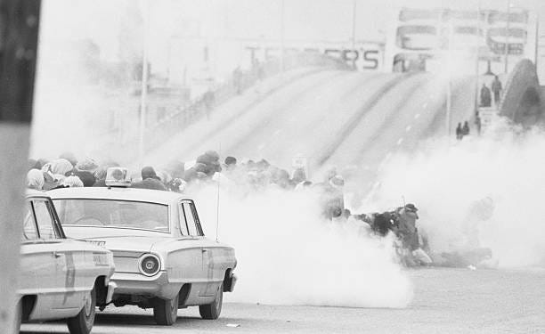 View of Civil Rights marchers in a cloud of tear gas at the base of the Edmund Pettus Bridge during the first Selma to Montgomery March, Selma,...