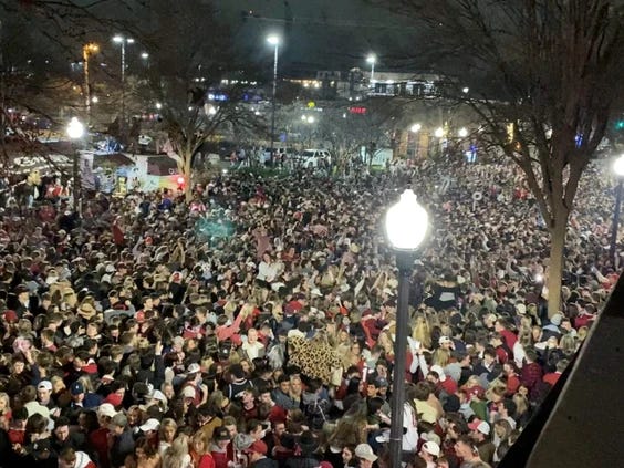 Alabama Crimson Tide fans flood the streets of Tuscaloosa after the team's college football championship win against Ohio State Monday, Jan. 11, 2021.. PHOTO BY JAMES BENEDETTO /Tuscaloosa Thread/via Reuters