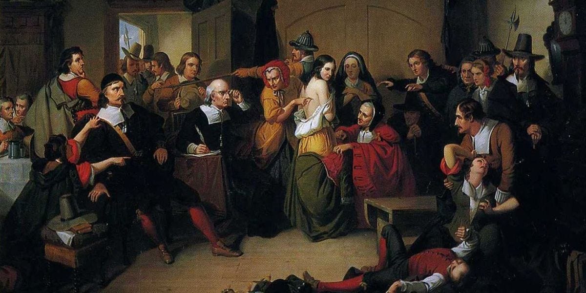 Salem witch trials: an overfilled court room features an accused woman’s skin being inspection for marks of witchcraft