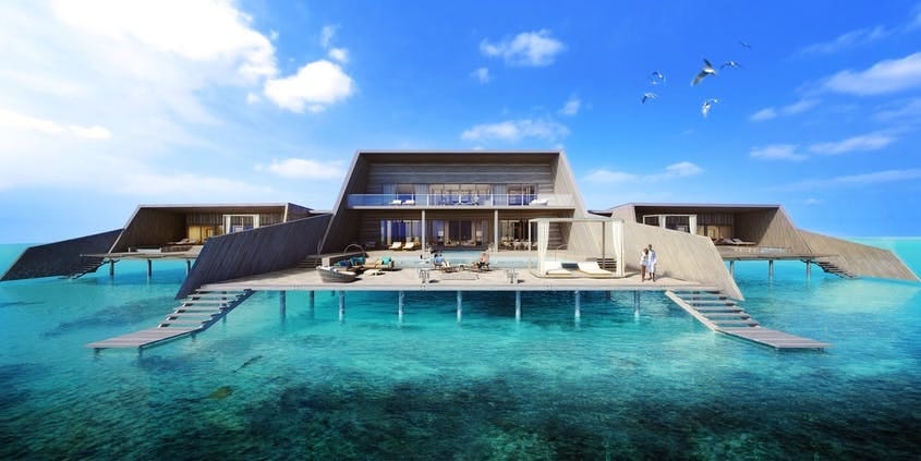 Escape to the St. Regis Maldives Vommuli Resort, which overlooks the Indian Ocean.