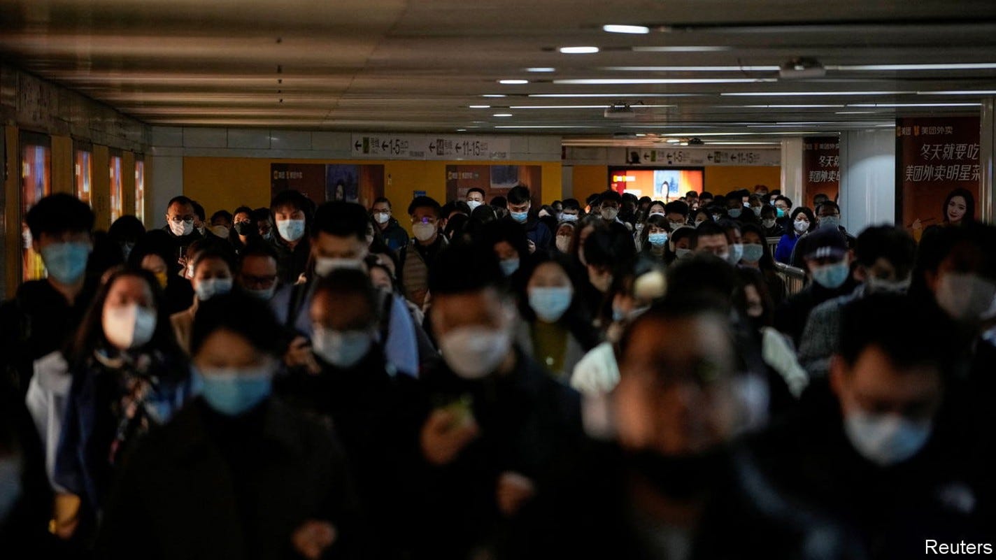 People wearing face masks walk in a subway station, as coronavirus disease (COVID-19) outbreaks continue in Shanghai, China, December 8, 2022. REUTERS/Aly Song