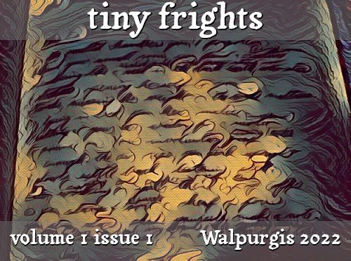 tiny frights volume 1 issue 1, Walpurgis 2022; a book with fiery, unreadable writing