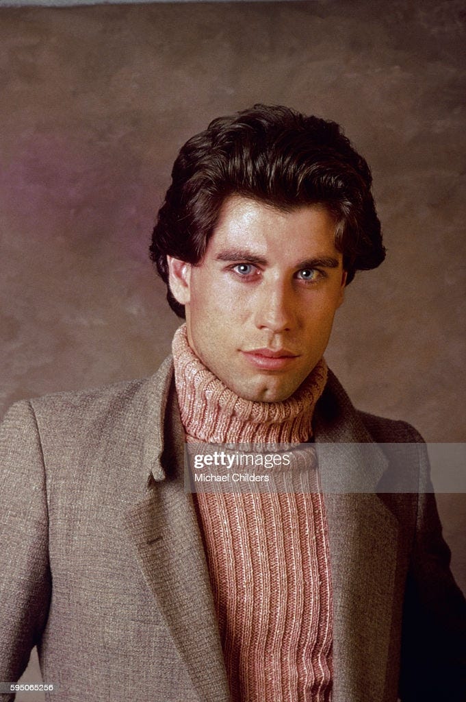 American actor John Travolta wearing brown turtleneck sweater and... News  Photo - Getty Images