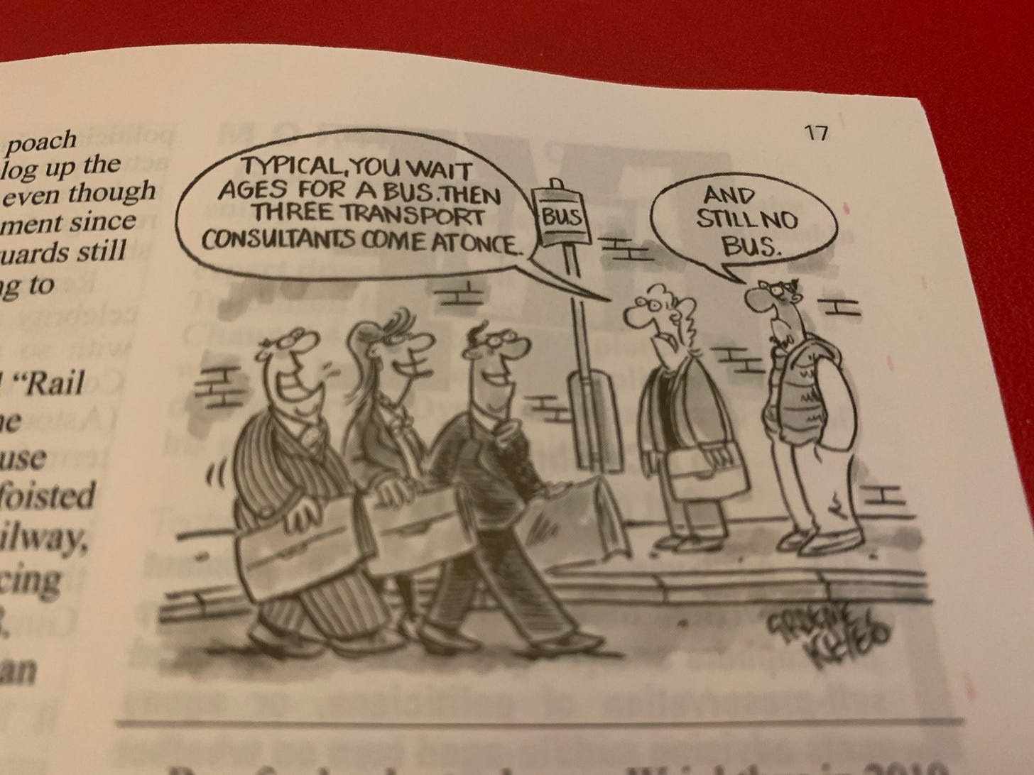 a cartoon from Private Eye of two people waiting at a bus stop. One says "typical, you wait ages for a bus and three transport consultants come at once."