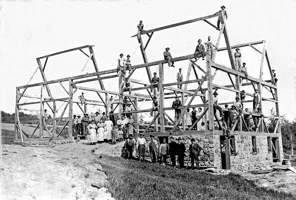 Wall Art - Photograph - A barn raising with all the neighbors by Underwood Archives