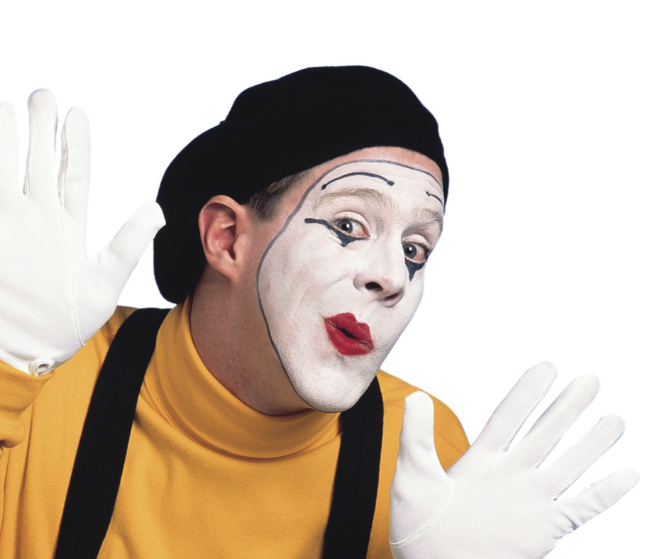 Mime pretending to press up against glass