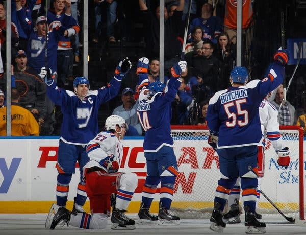 Mikhail Grabovski, center, after scoring in the first period. He was pressed into action on the Islanders&rsquo; top line in place of the injured Kyle Okposo.