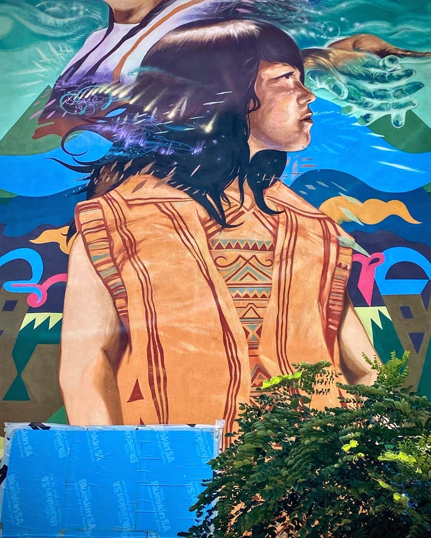 part of mural--indigenous girl looking into distance.