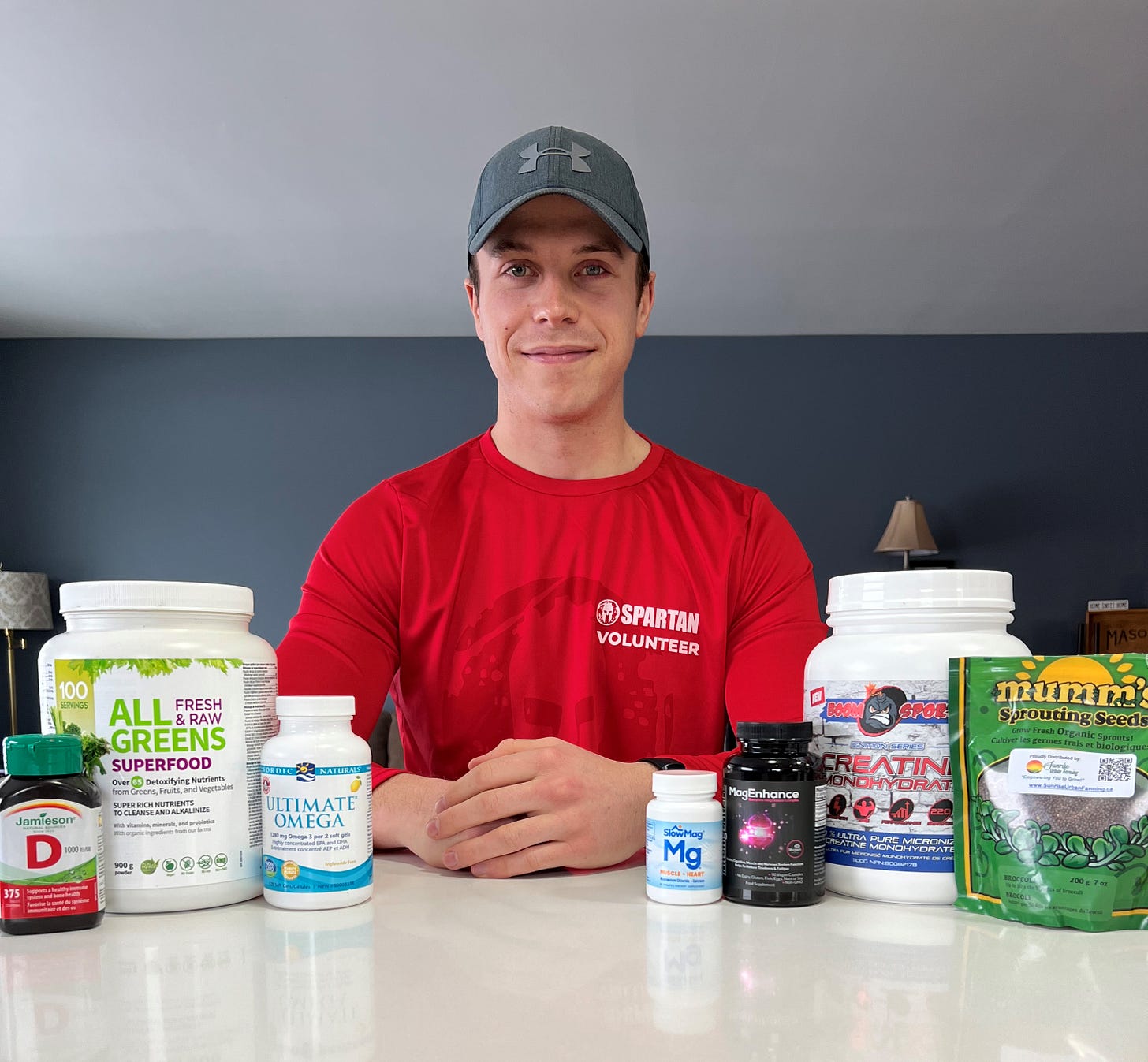 My current supplement stack. From left to right: Vitamin D, All Greens, Omega-3s, SlowMag (Mg Chloride + Calcium), MagEnhance (Mg L-Threonate, Mg Glycinate, Mg Taurate), Creatine, Broccoli Sprout seeds (for sprouting), whey protein powder (not shown above).