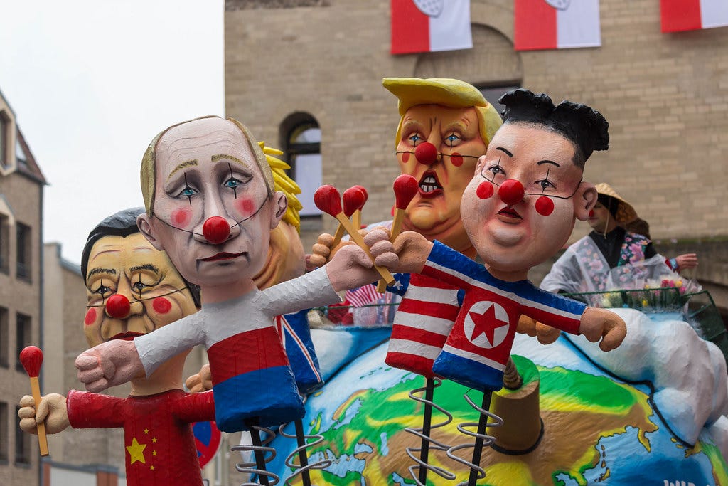 "Politicians, presidents and dictators like Kim Jong-un, Trump, Xi Jin Ping, Boris Johnson and Wladimir Putin set the world on fire on satiric carnivals wagon" by verchmarco is licensed under CC BY 2.0.