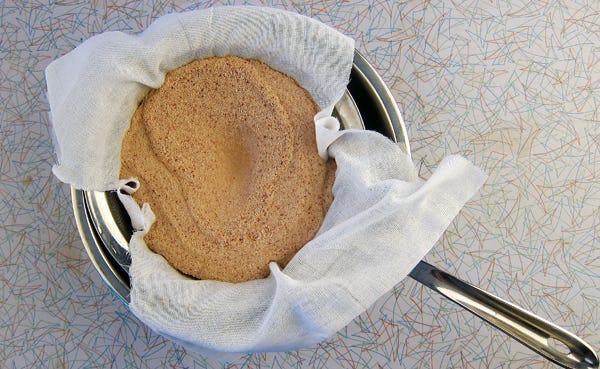 Straining water off freshly made acorn flour. 