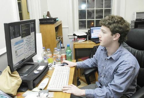 Thefacebook.com creator Mark E. Zuckerberg ’06 edits computer code for his popular website on his laptop in Kirkland House. The website, launched just last week, has already attracted about 4,000 members.
