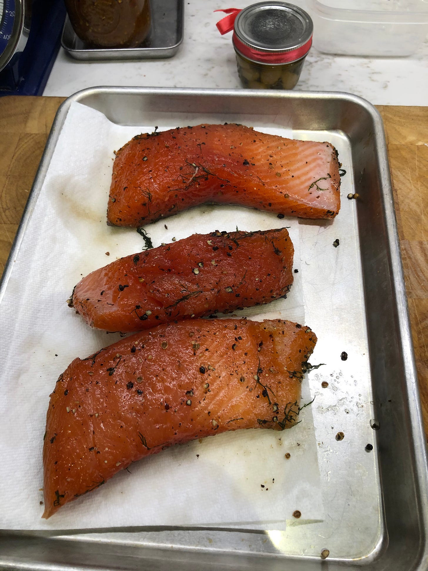 The gravlax, removed from the package and brushed fairly clean.