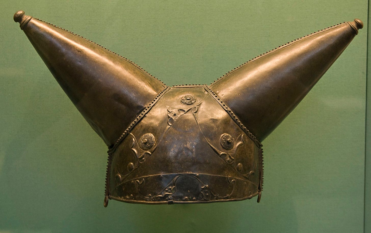 Bronze helmet with two conical horns