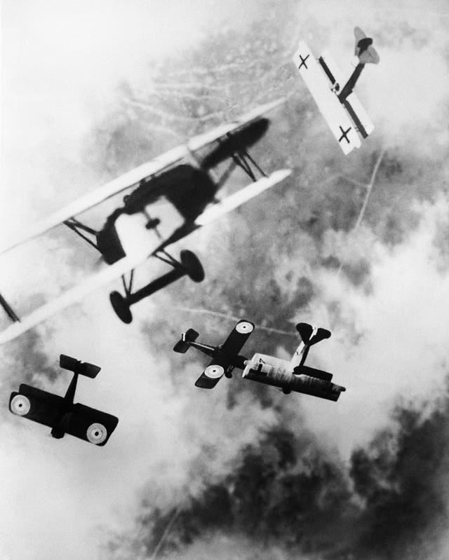 An aerial dogfight between at least 5 planes can be observed here. Dogfighting was the main method of attack between aircraft because the developments in aerial technology made it increasingly difficult to drop projectiles onto another plane. This dogfight took place over the Western Front, most likely near to France or Britain. 
