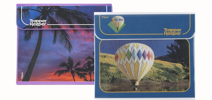 two trapper keepers, one with a sunset and one with a hot air baloon