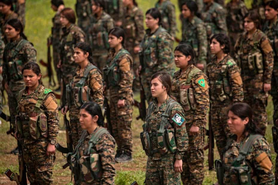 YPJ fighters at a military parade