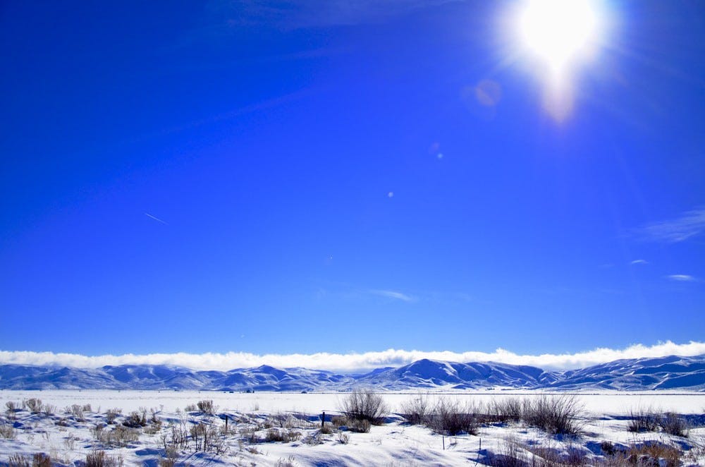 A bright blue sky on a snow valley