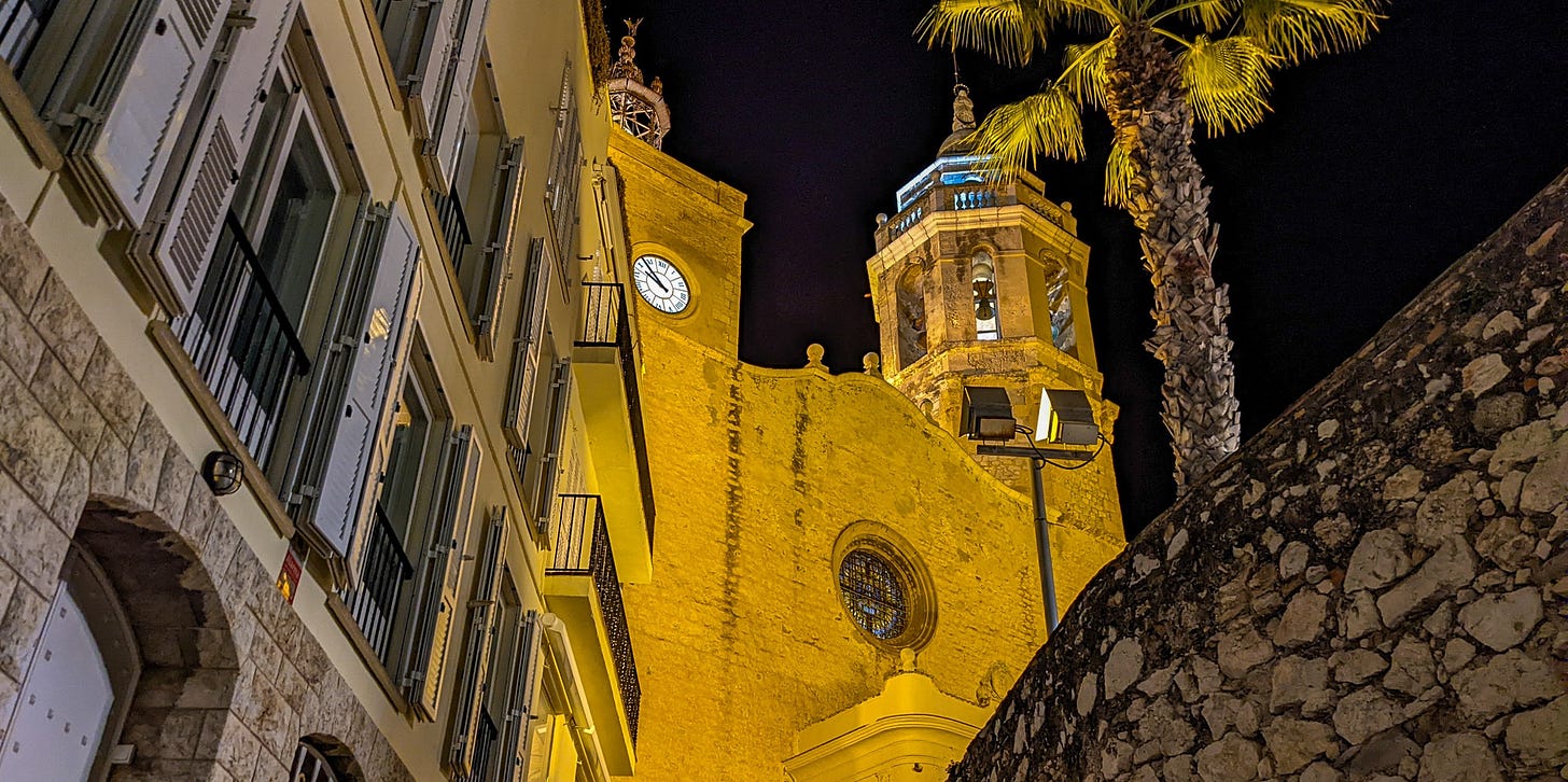 The Church of Sant Bartomeu & Santa Tecla lit up at night. 