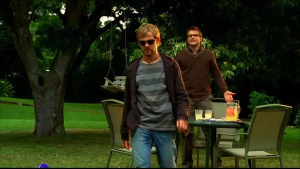 Charlie Pace (Dominic Monaghan) walks away from his brother Liam, and his brother Liam's very nice patio set.