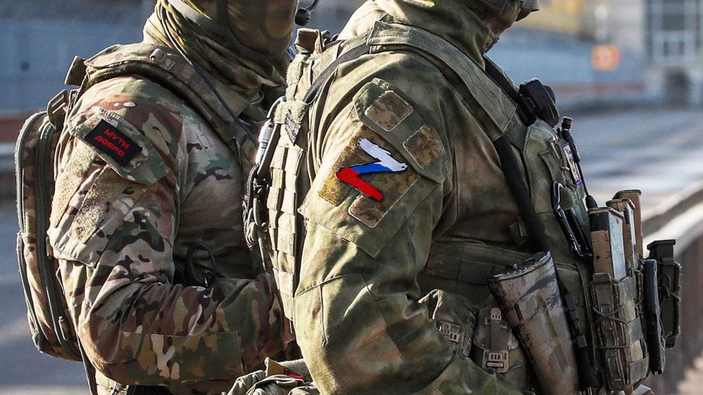 Russian servicemen stand guard near the Kakhovka Hydroelectric Power Plant near Kherson, Ukraine - 20 May 2022