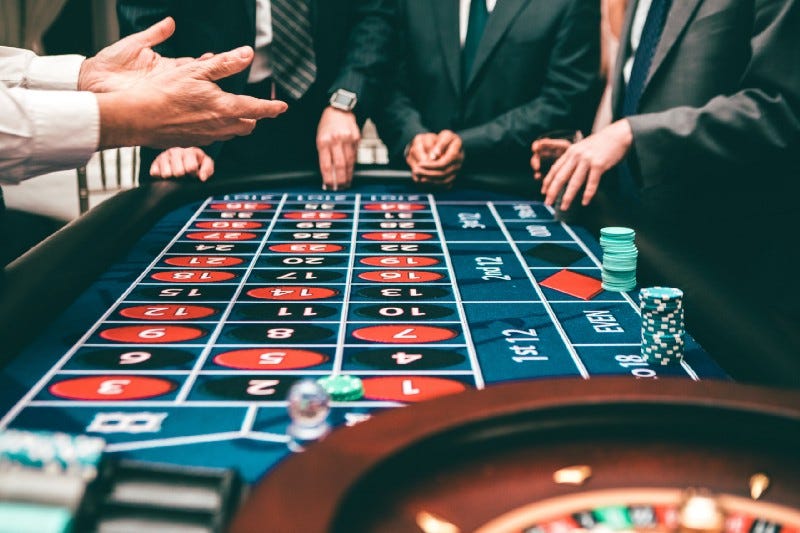 People gambling at a roulette table