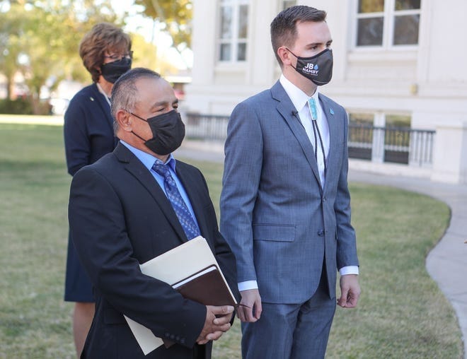 Newly elected Imperial Irrigation Board District directors Javier Gonzalez, left, and JB Hamby wait to be sworn at the Imperial County Courthouse in El Centro, December 4, 2020.