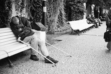 May be a black-and-white image of one or more people, people sitting and outdoors