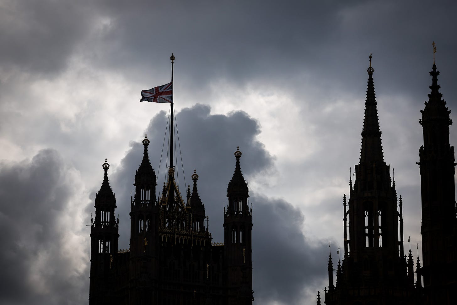 9th September 2022, Great Britain, London: A British flag on the House of Parliament flies at half-mast. (Photo by Christian Charisius/picture alliance via Getty Images).