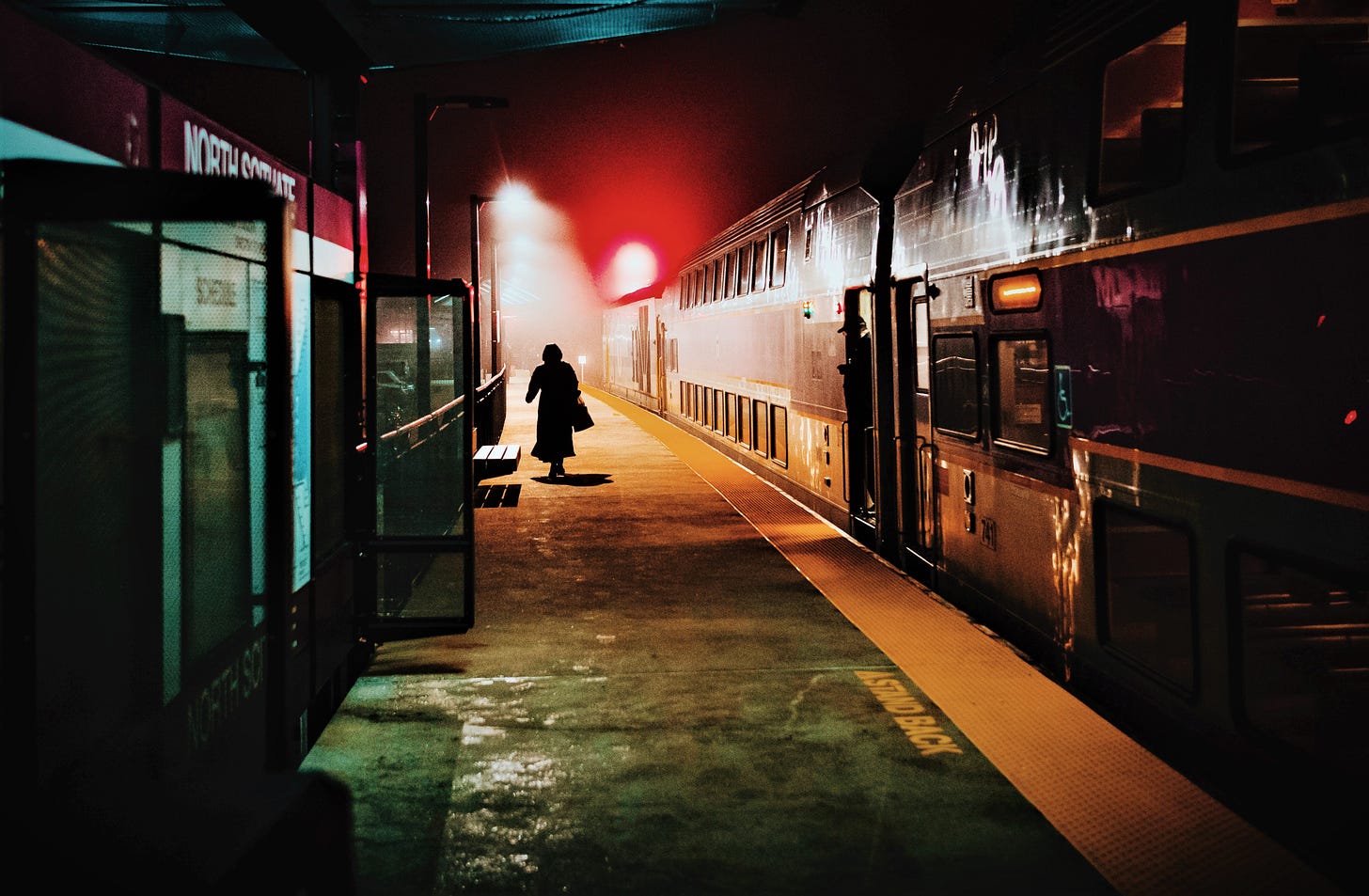 Night time photos of woman in train station