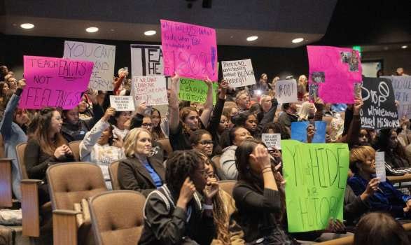 Students, parents and others hold signs showing their opinions about critical race theory during a Tuesday, Dec. 13, 2022, Temecula Valley Unified School District board meeting at Temecula Valley High School. (Photo by Nick Koon, Contributing Photographer)
