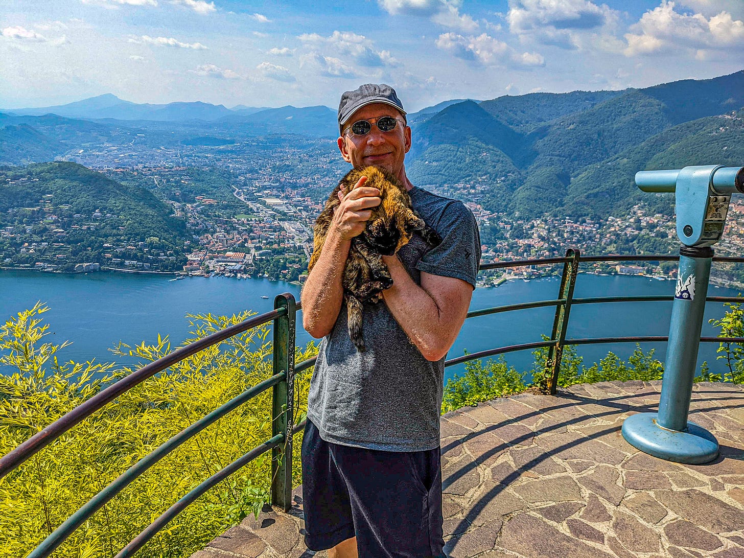 Brent and a new feline friend enjoying the view from Brunate.