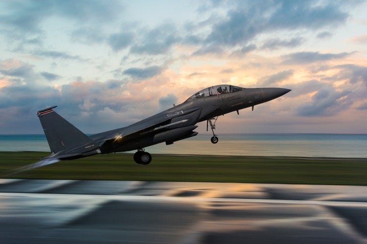 F-15 Figter Jet taking off at sunset