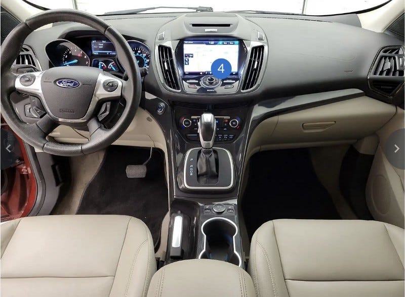The dashboard of our new 2014 Ford Escape Titanium